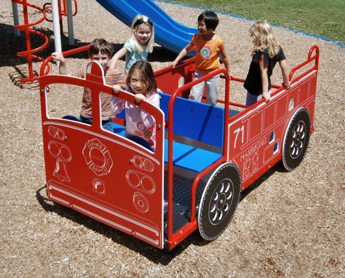 school children on a playgournd firetruck