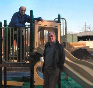 Owners of Kidstuff Playsystems on a tan and green playsystems