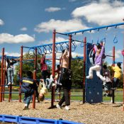 Kids swinging on monkey bars